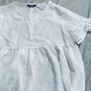 White peplum blouse (makeup stain on the inside)